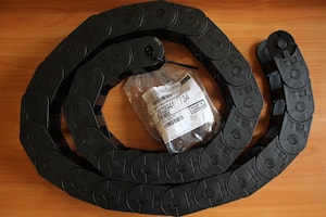 Пластиковая цепь в стрелу Bobcat TD40150 #84192.4 26.05.074 (27.05.074)