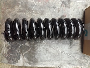 Пружина механизма натяжения гусеницы #RG511-21420